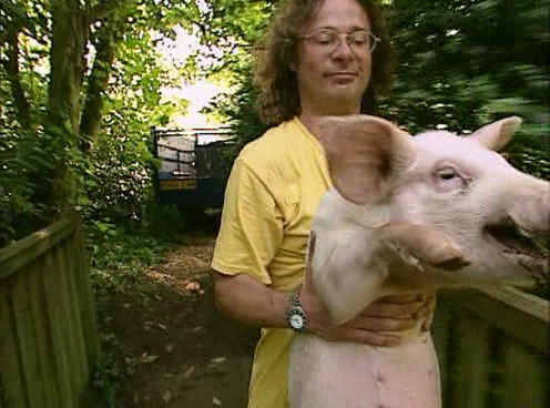 Hugh fearnel whittingstall with a pig